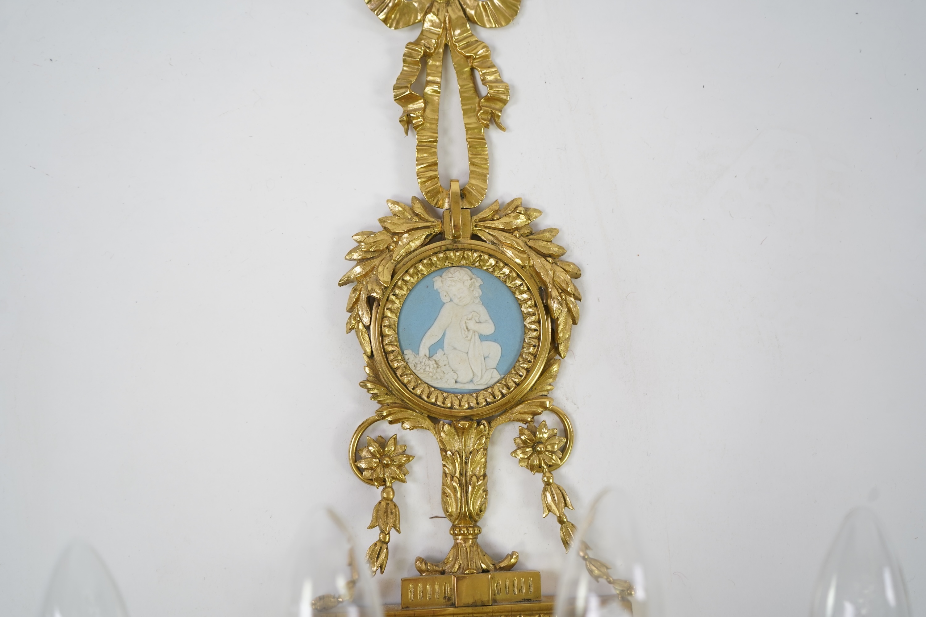 A set of four Adam style ormolu and jasper ware mounted wall appliques, early 20th century